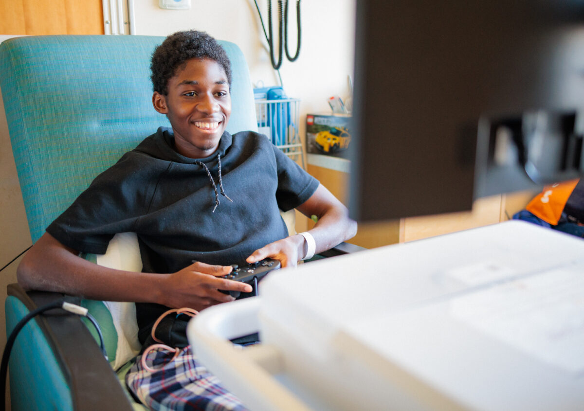Child playing on GO Kart (Gamers Outreach Kart).